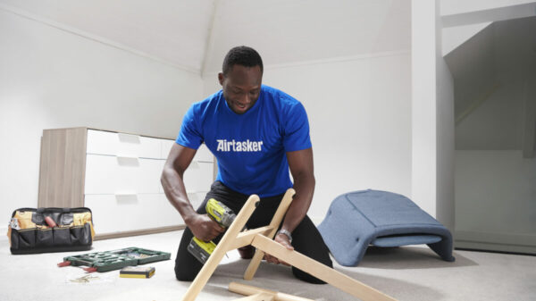 a picture of a person completing a task wearing an AirTasker uniform
