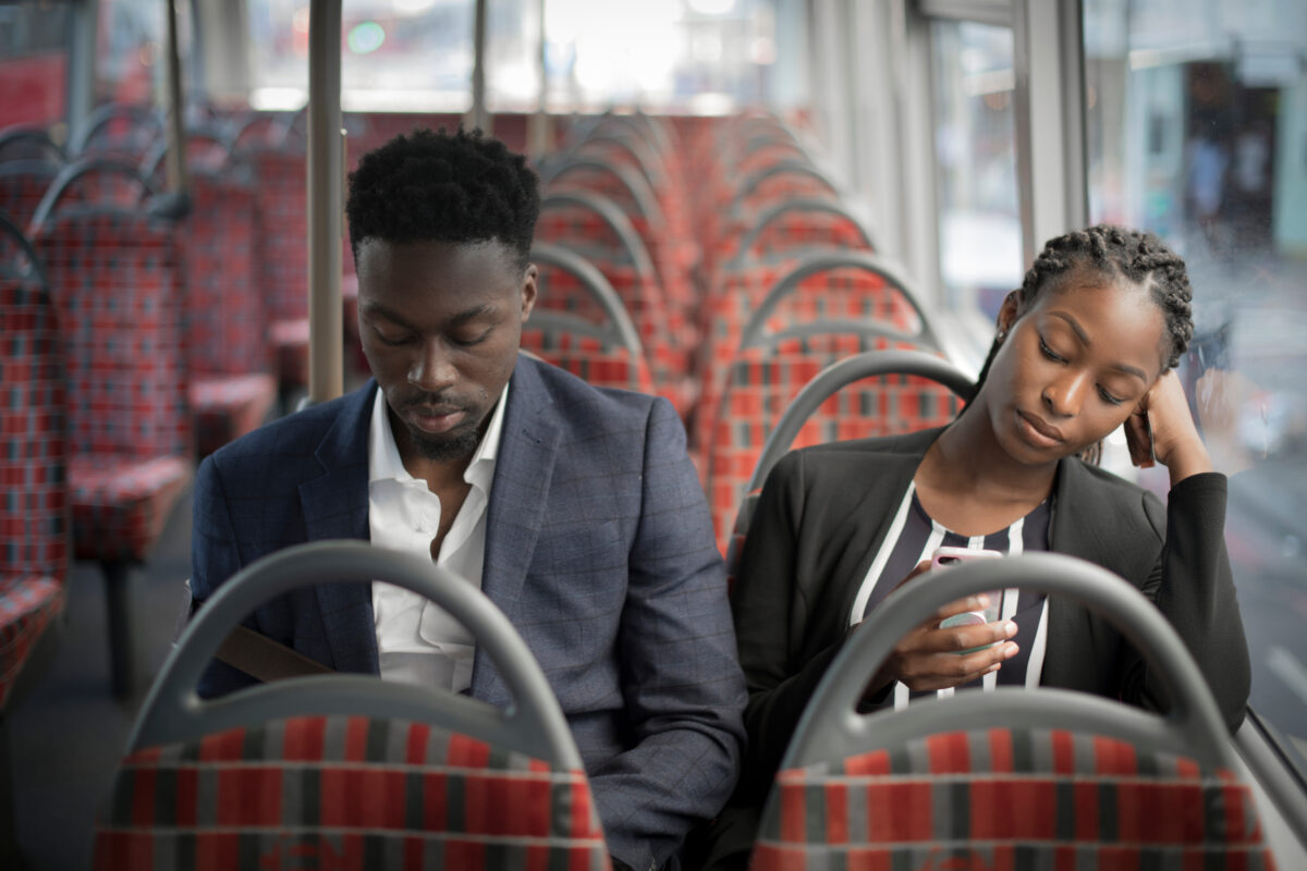 More than three-quarters of Black British people believe that ads portray black culture better than they did 10 years ago, reveals the latest figures, here depicting two black business people on the way to work on a bus