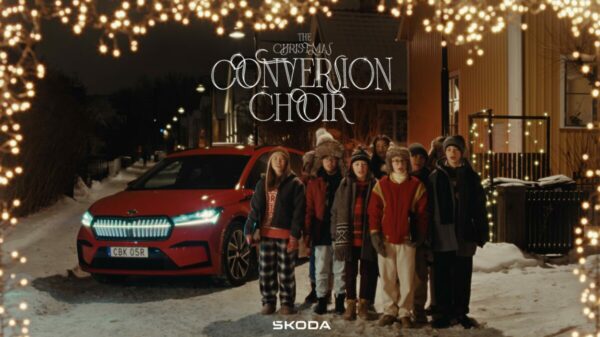 Carol singing choir pictured next to Škoda vehicle.In a festive campaign car brand Škoda puts a spotlight on the role of carols in evoking the spirit of Christmas.