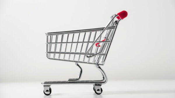 A small trolley against a white background is used to represent retail media. Retail media spend is expected to reach £121.1bn ($153.3bn) before the end of the year, according to Warc's new 'Future of  Digital Commerce' report.