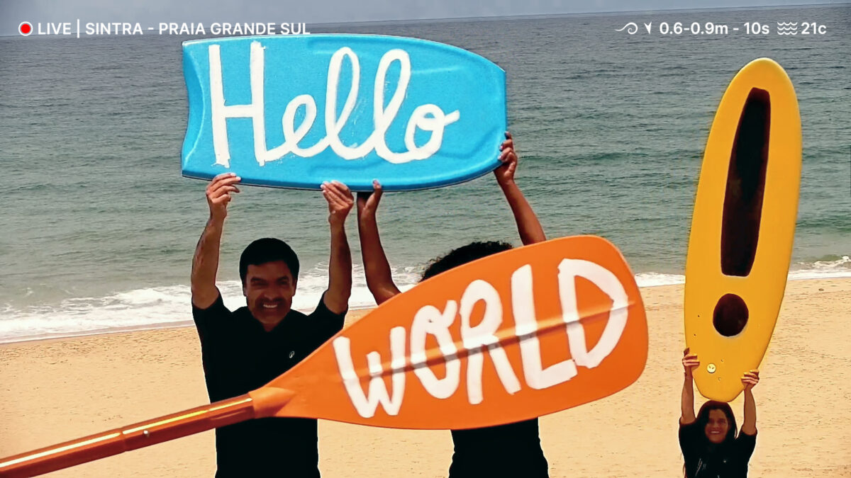 Family clad in Decathlon wetsuit hold up oars which read Hello World. Decathlon hacks surf cams in its latest campaign, spotlighting its natural wetsuits, with a range of footage from live feeds.
