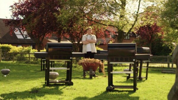 Farmer Will arms crossed in front of his beloved barbecues. It might have a reputation as more red trousers than Gen Z, but Waitrose's social media reach is up by 40% as it embraces TikTok and Instagram.