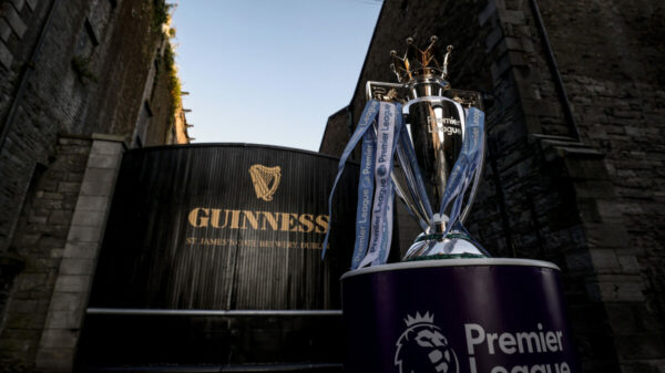 Guiness gate at St James' Brewery Dublin behind a Premier League trophy. Guinness has confirmed its first ever global partnership with the Premier League as it becomes the official beer of the Premier League for the 2024/25 season.