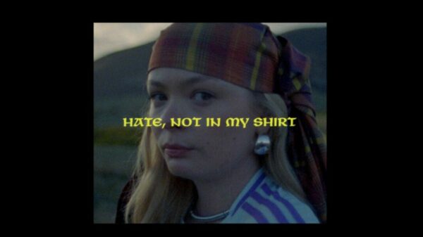 A young Scotland found stands at the glen, proudly with tartan around her head "Not In My Shirt! reads text in front. EE ad is kicking off its 'Not In My Shirt' campaign with a rousing TV ad launching during England vs Scotland tonight (14 June).