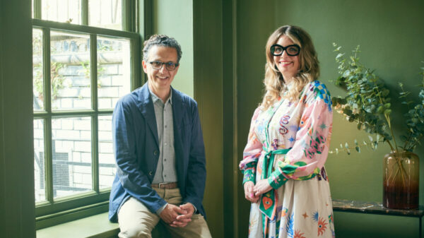 Caroline Parkes and David Abrahams. Caroline Parkes is wearing a flowery dress while David Abrahams is wearing a set of plain clothes and new suit jacket. Wonderhood is setting up a new team centred on customer experience and relationship management, under the leadership of Caroline Parkes.